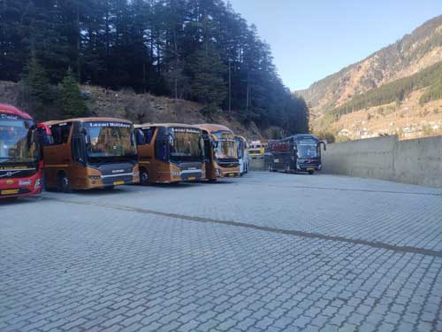 Early morning Volvo buses ready to depart from Manali	